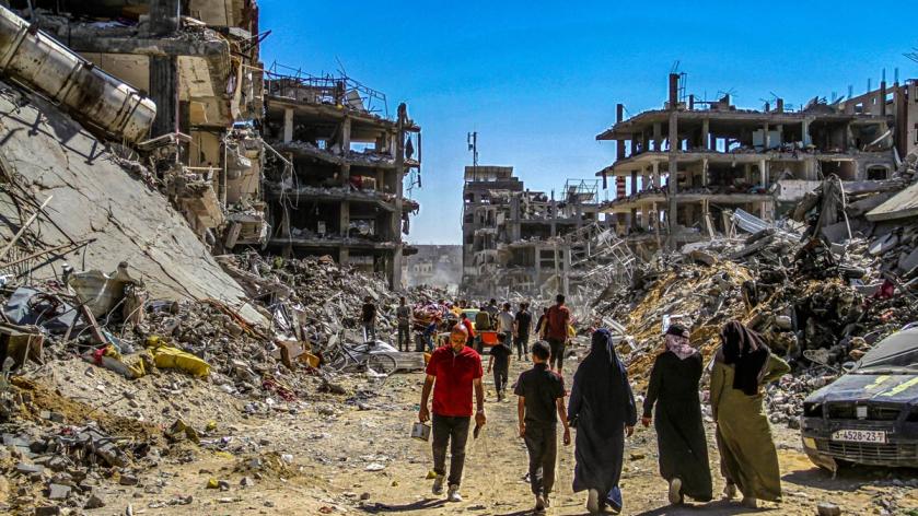 Palestinians walk among the rubble after returning to their neighbourhood destroyed during the Israeli military operations lasting for 3 weeks in Jabalia, Gaza. 1 June 2024