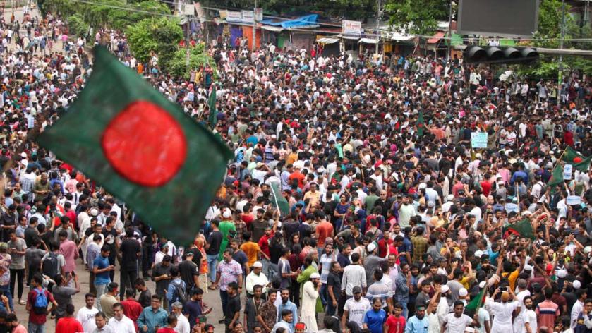 Anti-government protestors celebrate after protests that began as student-led demonstrations against government hiring rules in July, culminated in the prime minister fleeing and the military announcing it would form an interim government. Dhaka, 5 August 2024