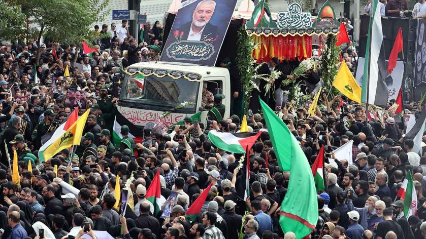 Iranians take part in a funeral procession for late Hamas leader Ismail Haniyeh, in Tehran, ahead of his burial in Qatar, 1 August 2024. 